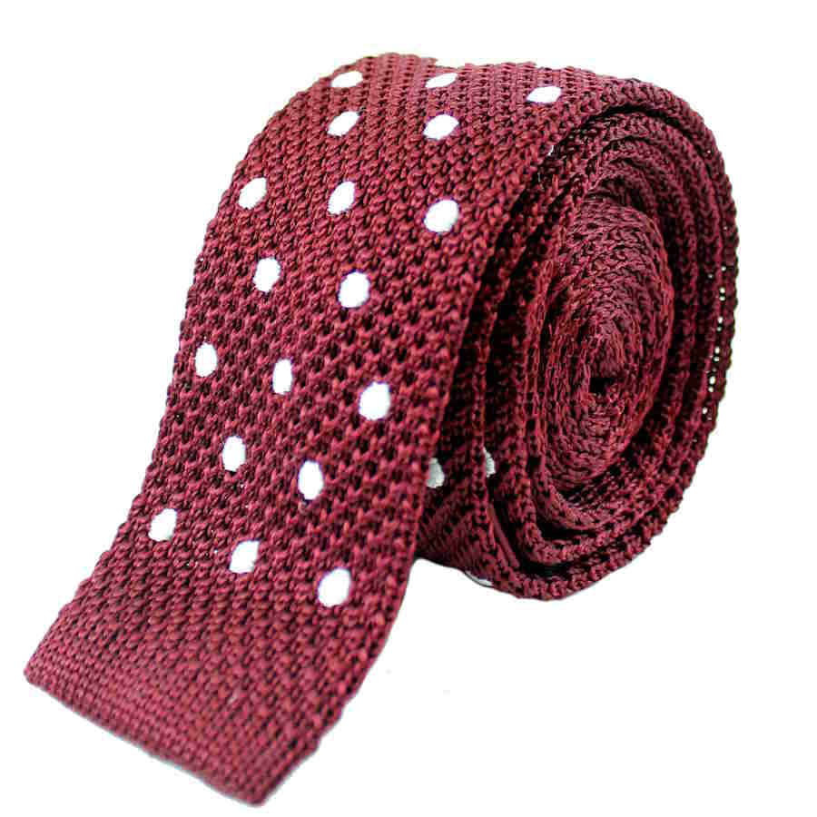 burgundy with white polka dot knitted silk tie rolled up with the straight edge end showing