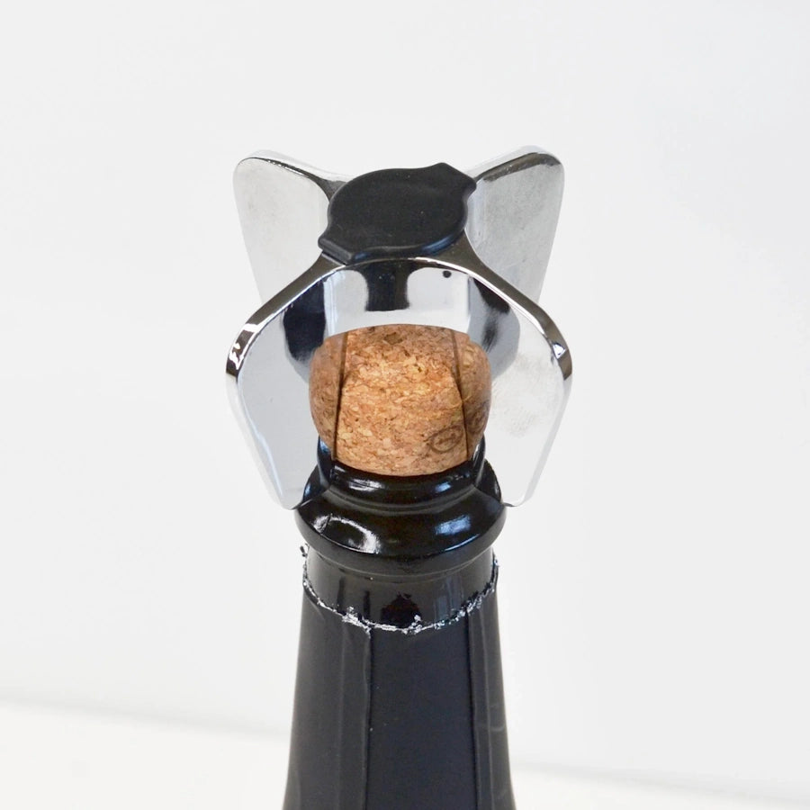 champagne star shaped bottle opener on champagne cork in bottle