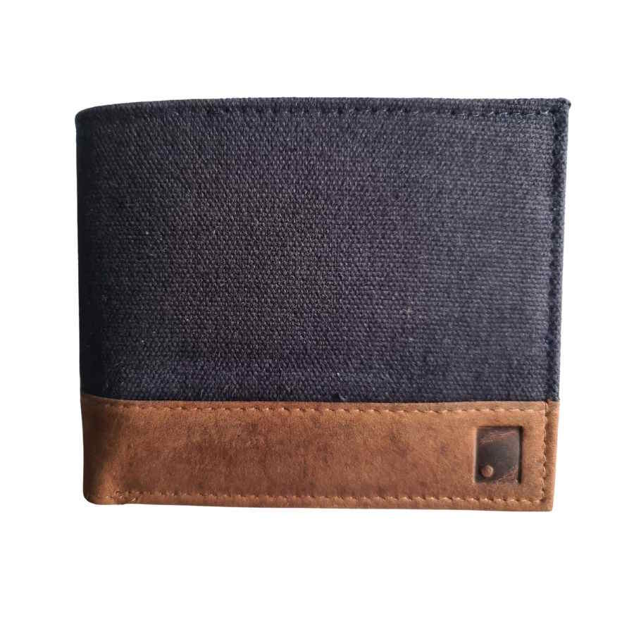 front view of waxed navy canvas wallet with leather trim  