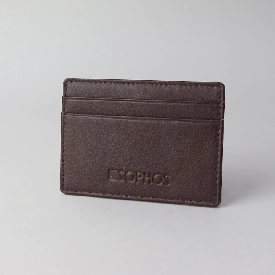 front of smooth brown pebble grain leather card holder with two  card slots featuring the brand Sophos embossed on the leather