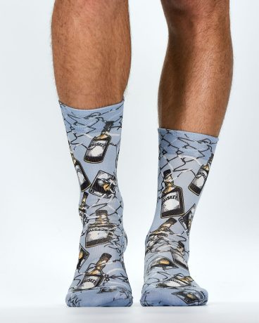 mens socks with all over print featuring whiskey bottles viewed from front